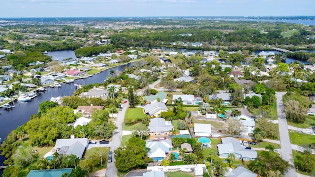 bird's eye view featuring a water view and a residential view