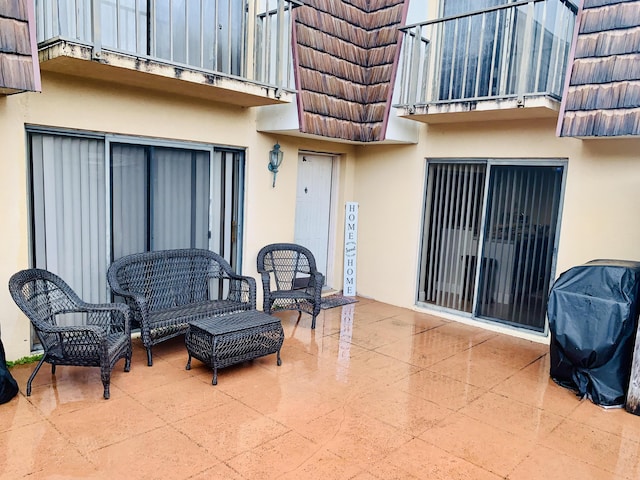 view of patio / terrace with a balcony and grilling area