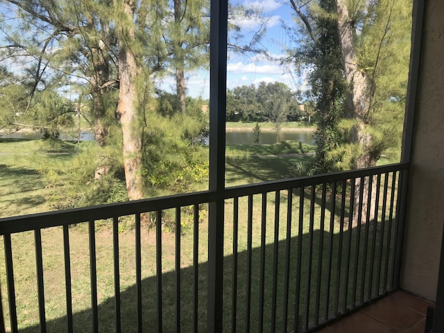 balcony featuring a water view