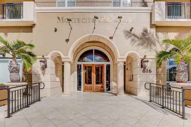 doorway to property with french doors and stucco siding