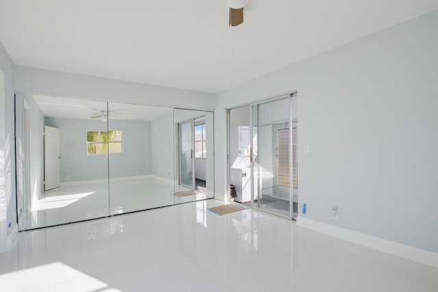 unfurnished bedroom featuring a closet and a ceiling fan