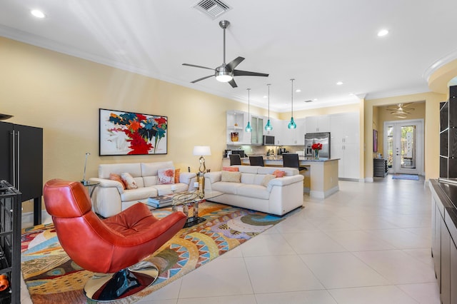 living room with visible vents, ceiling fan, light tile patterned flooring, crown molding, and recessed lighting