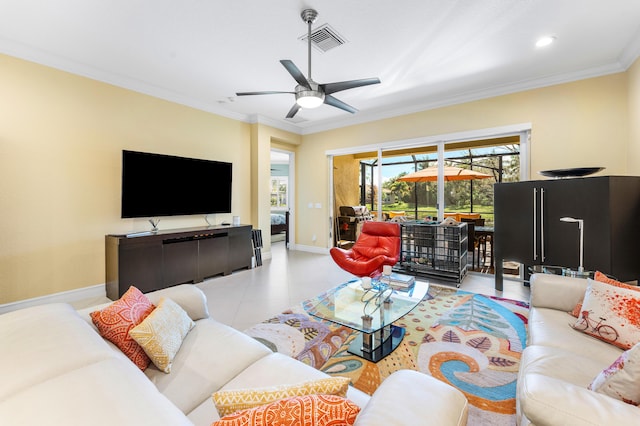 living area with light tile patterned floors, baseboards, visible vents, ceiling fan, and crown molding