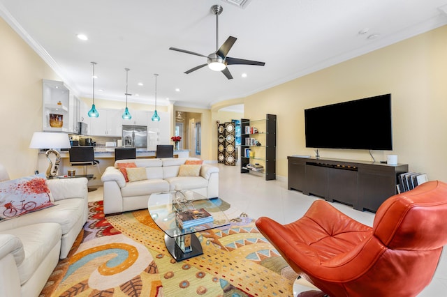 living area with a ceiling fan, recessed lighting, light tile patterned flooring, and crown molding