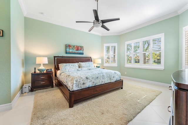 bedroom featuring light tile patterned floors, baseboards, and crown molding