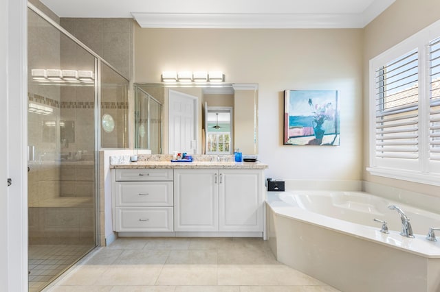 bathroom featuring a bath, a shower stall, vanity, and crown molding