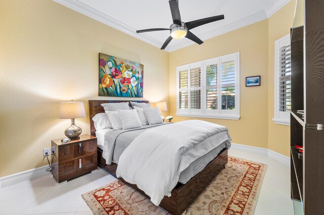 bedroom with light tile patterned floors, baseboards, and ornamental molding