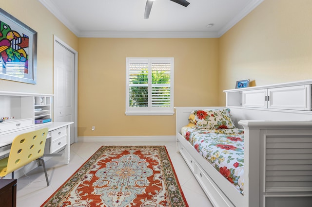 bedroom featuring light tile patterned floors, ornamental molding, a ceiling fan, and baseboards