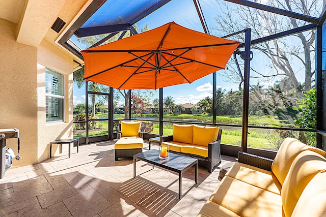 view of patio featuring glass enclosure and an outdoor living space