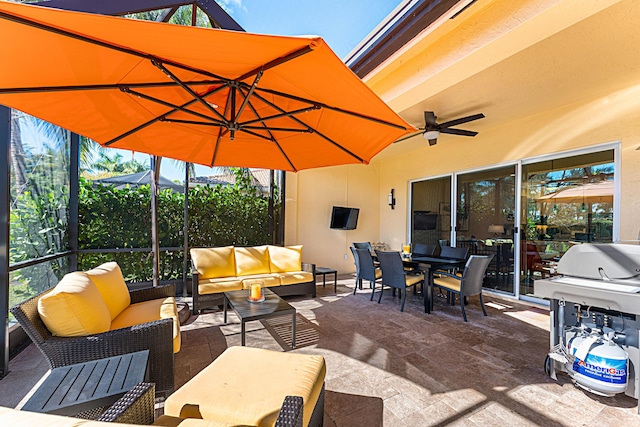 view of patio featuring outdoor dining area, outdoor lounge area, a lanai, and a ceiling fan