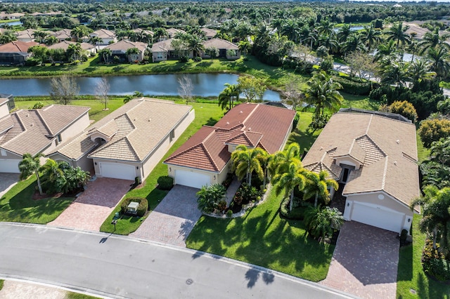 drone / aerial view featuring a water view and a residential view