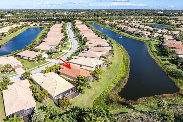 bird's eye view featuring a water view and a residential view