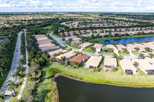 birds eye view of property featuring a water view and a residential view