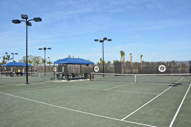 view of sport court with fence