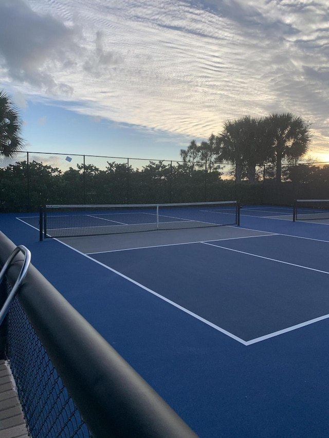 view of sport court with fence