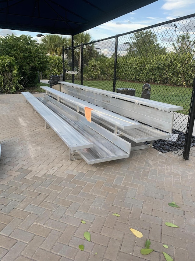 view of property's community with a patio area and fence