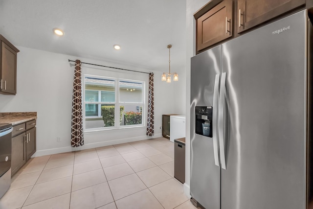 5361 San Benedetto Pl, Fort Pierce, FL 34951 - kitchen featuring recessed lighting, baseboards, stainless steel fridge with ice dispenser, and light tile patterned floors