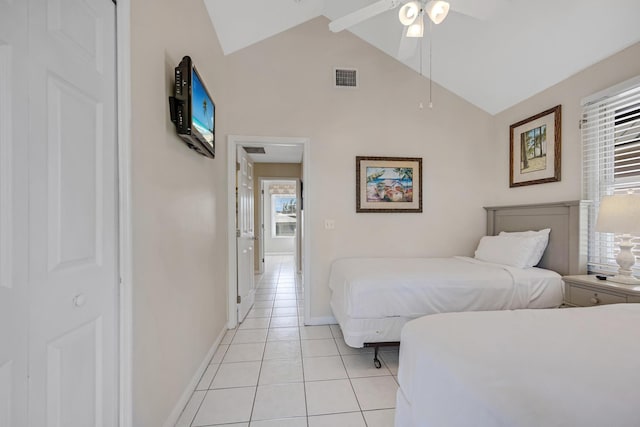 bedroom featuring light tile patterned floors, baseboards, visible vents, a ceiling fan, and high vaulted ceiling