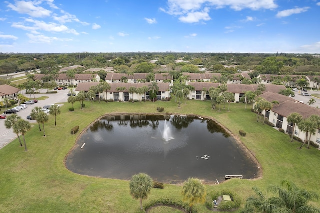 drone / aerial view featuring a water view and a residential view