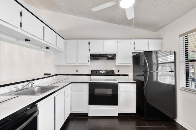 kitchen with electric range, freestanding refrigerator, a sink, under cabinet range hood, and dishwashing machine