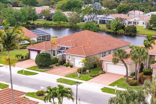 bird's eye view featuring a residential view and a water view