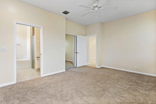 unfurnished bedroom featuring visible vents, baseboards, and carpet flooring