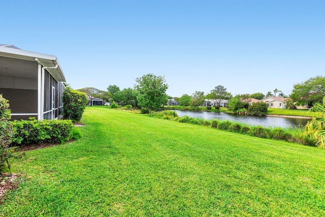 view of yard with a water view