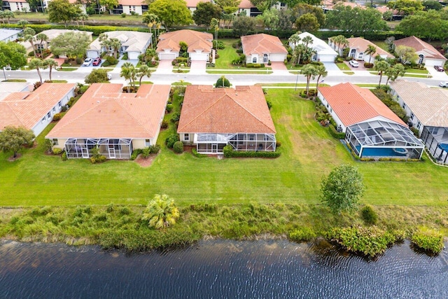 bird's eye view with a residential view and a water view