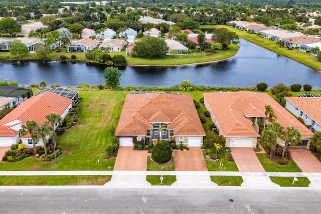 aerial view with a residential view and a water view