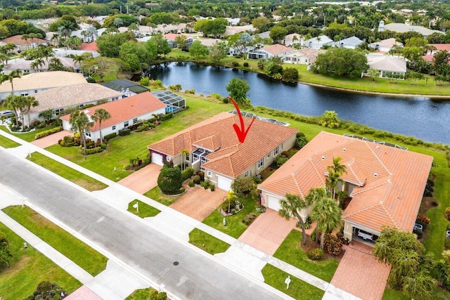 bird's eye view featuring a residential view and a water view