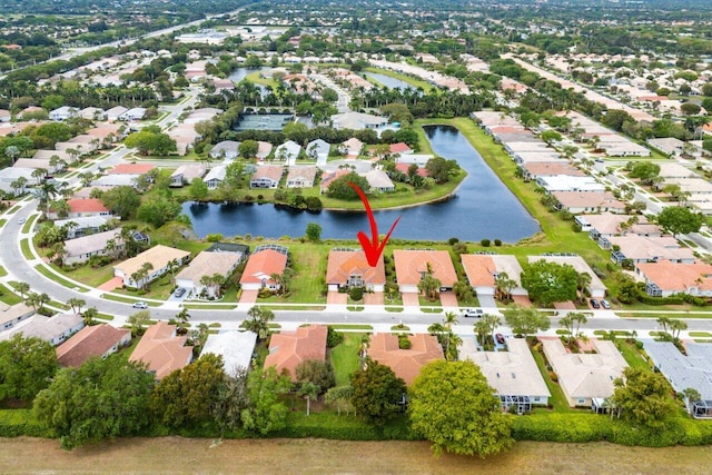 aerial view with a residential view and a water view