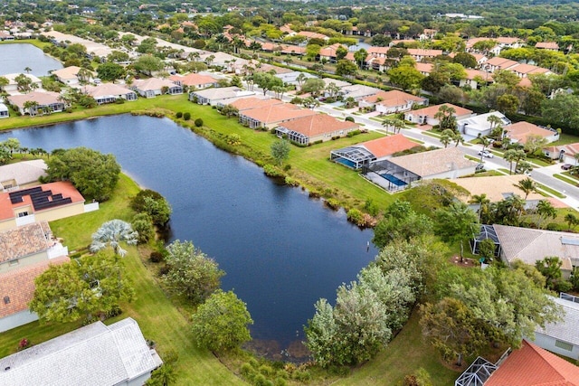 birds eye view of property featuring a residential view and a water view