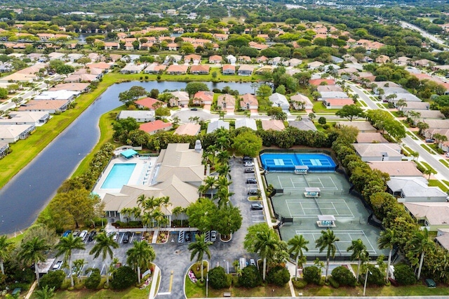 birds eye view of property featuring a residential view and a water view