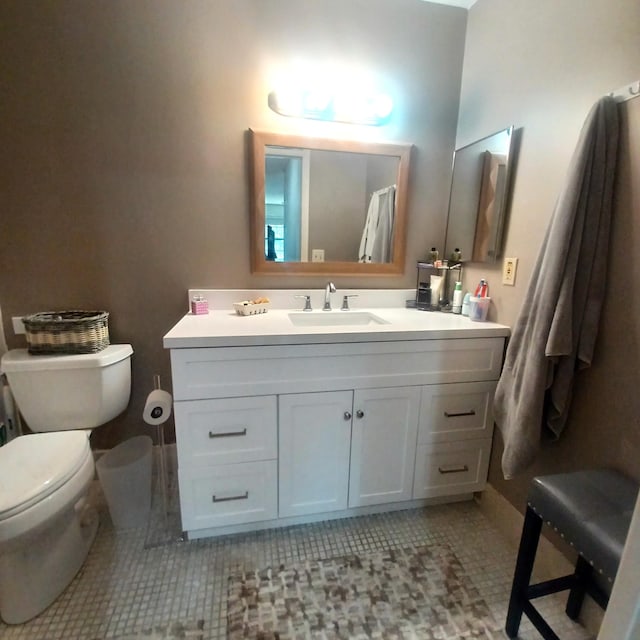 5070 Nesting Way Unit B, Delray Beach, FL 33484 - bathroom featuring tile patterned floors, toilet, and vanity