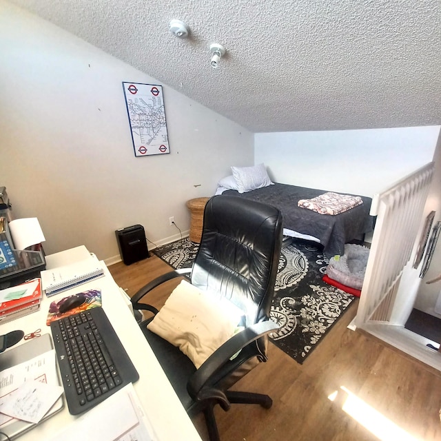 5070 Nesting Way Unit B, Delray Beach, FL 33484 - office area featuring baseboards, lofted ceiling, a textured ceiling, and wood finished floors
