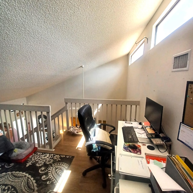 5070 Nesting Way Unit B, Delray Beach, FL 33484 - office with wood finished floors, visible vents, and a textured ceiling