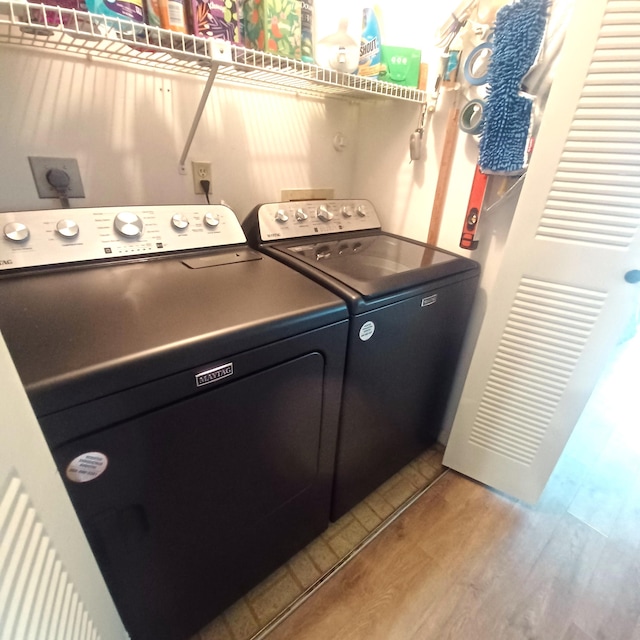 5070 Nesting Way Unit B, Delray Beach, FL 33484 - laundry room featuring light wood-style flooring, laundry area, and washer and clothes dryer