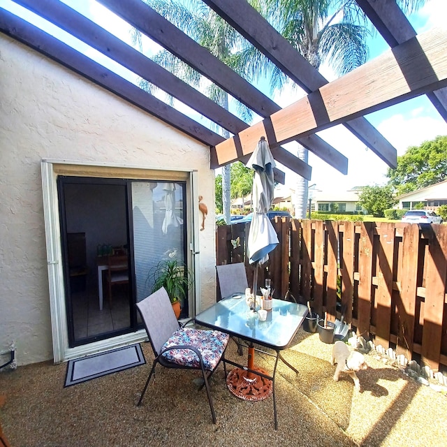 5070 Nesting Way Unit B, Delray Beach, FL 33484 - view of patio / terrace with outdoor dining area, fence, and a pergola