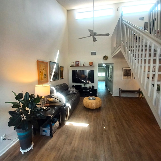 5070 Nesting Way Unit B, Delray Beach, FL 33484 - living room with visible vents, wood finished floors, a towering ceiling, ceiling fan, and stairs