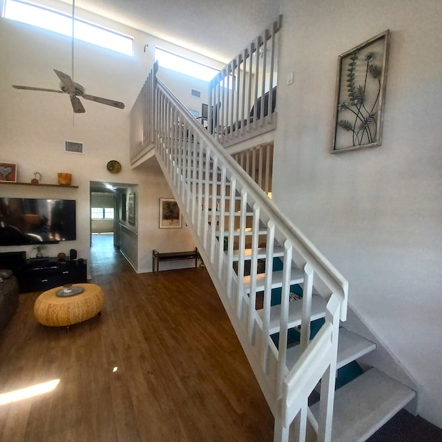 5070 Nesting Way Unit B, Delray Beach, FL 33484 - staircase featuring a wealth of natural light, visible vents, a high ceiling, and wood finished floors