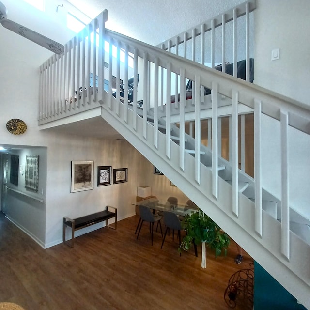 5070 Nesting Way Unit B, Delray Beach, FL 33484 - stairs with a high ceiling and wood finished floors