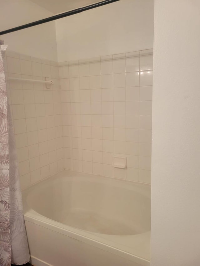 full bathroom with shower / bath combo