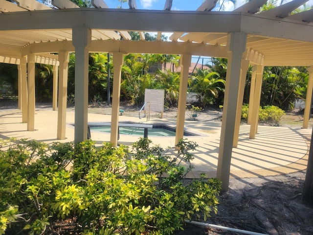 view of patio featuring a swimming pool and a pergola