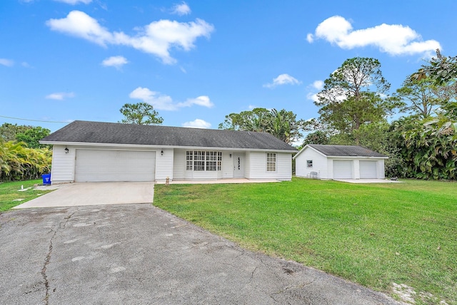 ranch-style home featuring a garage and a front yard