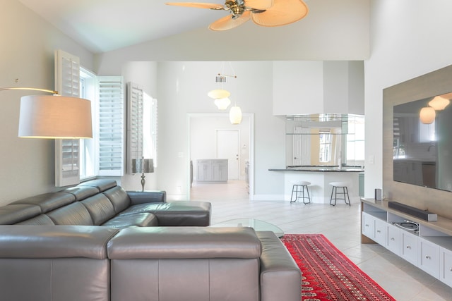 living room with high vaulted ceiling, a ceiling fan, visible vents, and light tile patterned floors