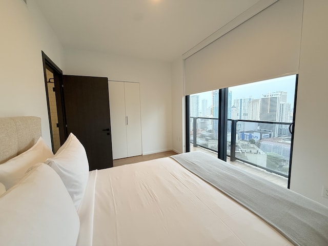 bedroom featuring a view of city