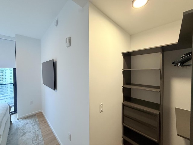 interior space with wood finished floors and baseboards