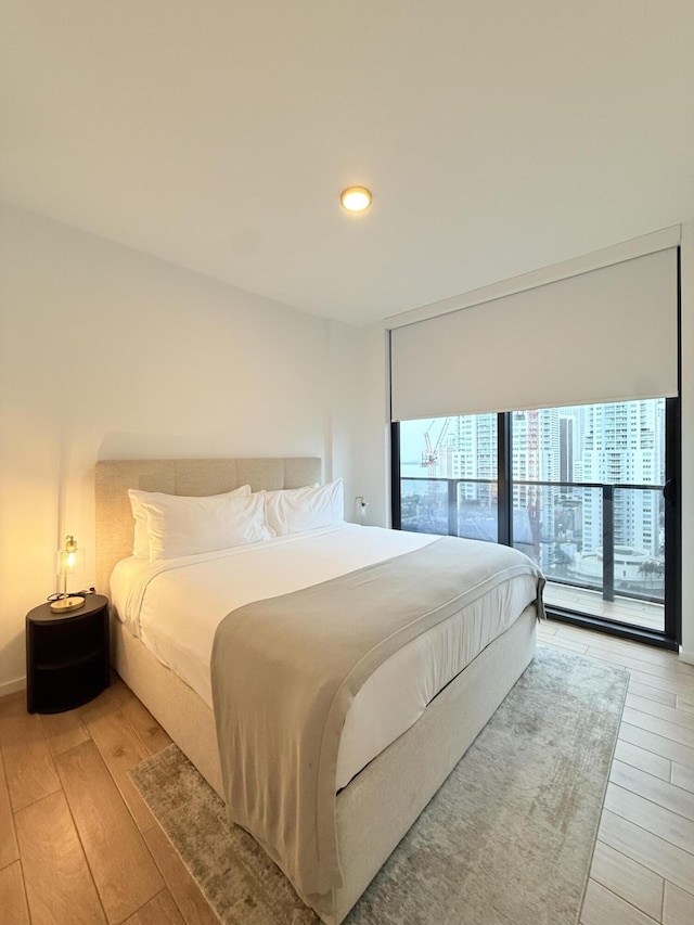 bedroom with wood finished floors