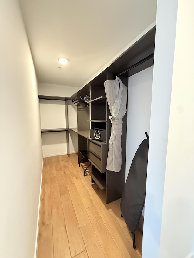 spacious closet with light wood finished floors