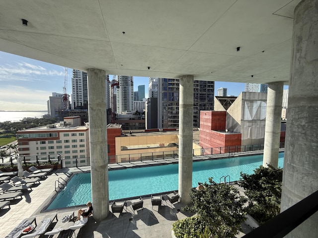 community pool featuring a city view and a patio